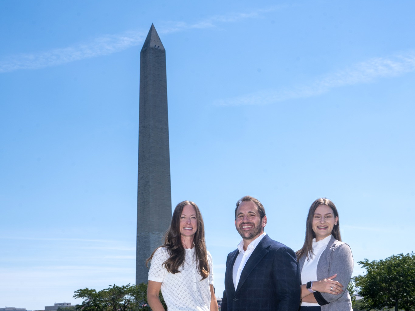 Dr. Benjamin Stein, Lauren George, and Christine Johnson with the Washington Monument in Washington, DC